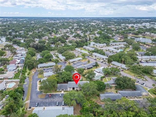 a view of a tree in front of a house