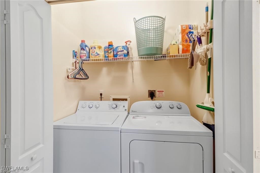 8261 Pathfinder Loop, Unit 745 Fort Myers, FL 33919 - Photo 13 of 22 a utility room with dryer and washer