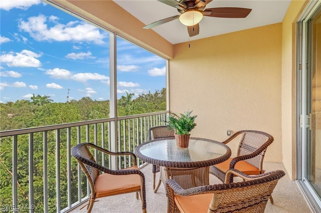8261 Pathfinder Loop, Unit 745 Fort Myers, FL 33919 - Photo 15 of 22 a view of a balcony with table and chairs
