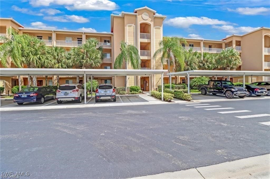 8261 Pathfinder Loop, Unit 745 Fort Myers, FL 33919 - Photo 16 of 22 a view of houses with street