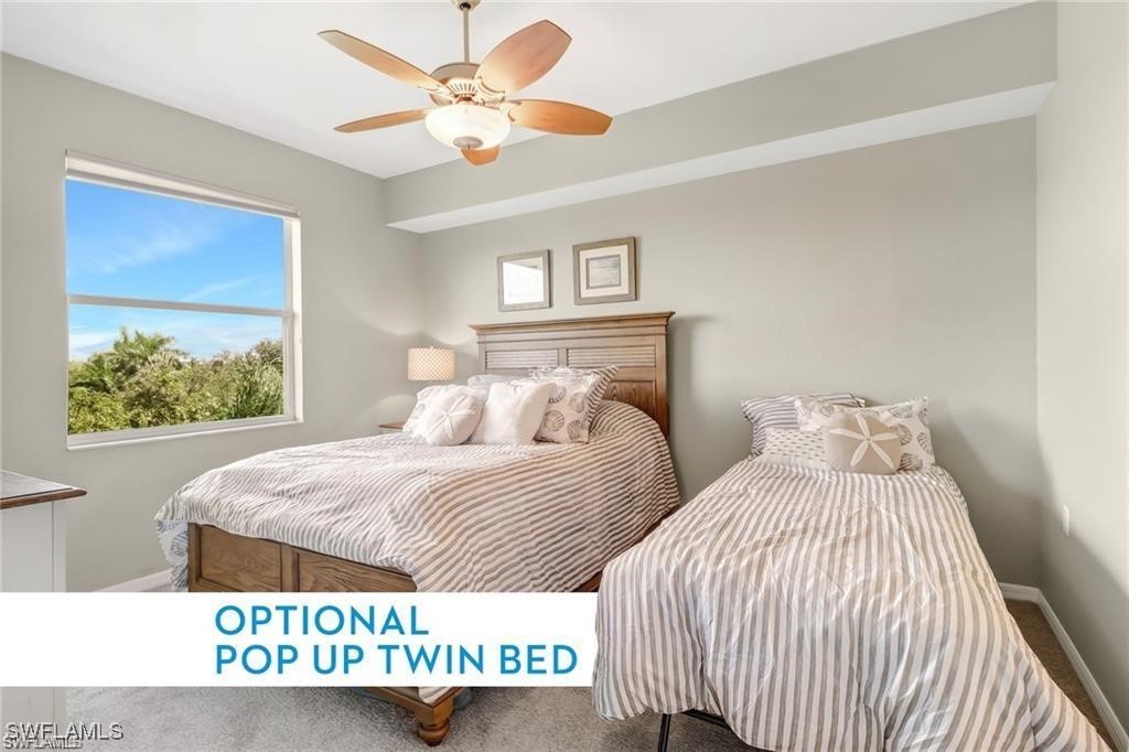 8261 Pathfinder Loop, Unit 745 Fort Myers, FL 33919 - Photo 9 of 22 a bedroom with two beds and a window