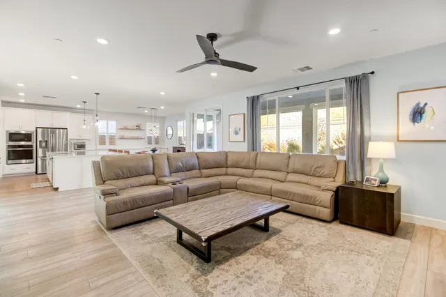 a kitchen with stainless steel appliances a stove microwave and a refrigerator