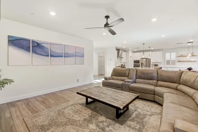 a living room with furniture and a rug