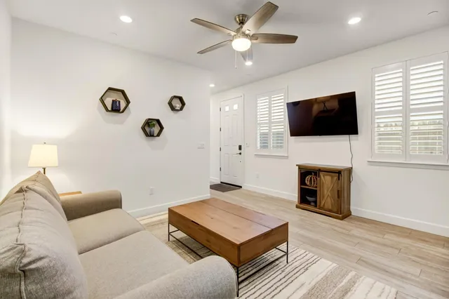 a living room with furniture and a couch
