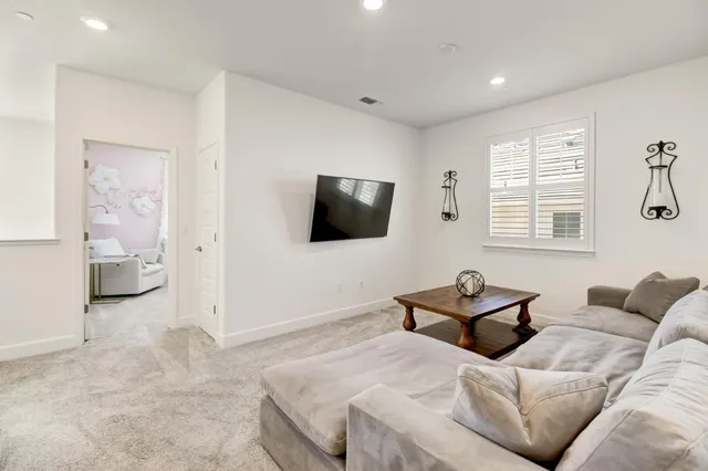 a bedroom with a bed and a table