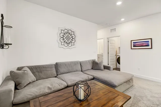 a bedroom with a large bed and a window