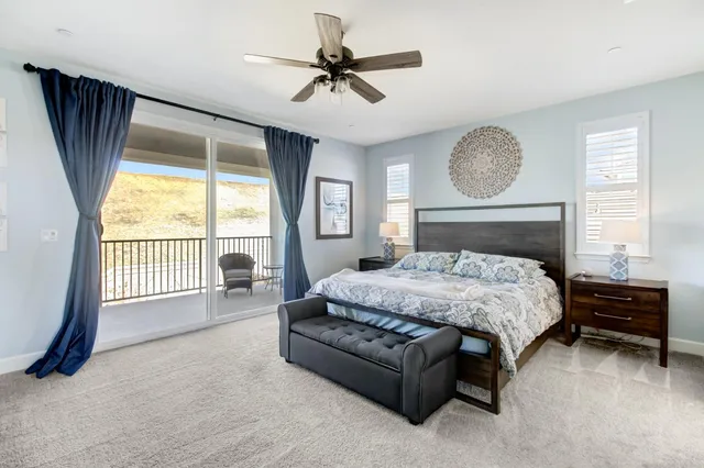 a en suite bathroom with a double vanity sink and a mirror