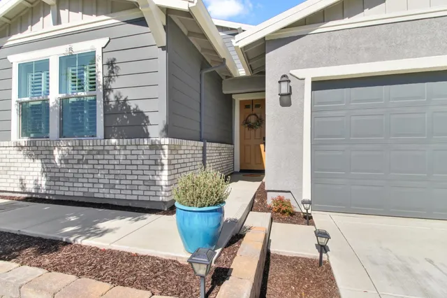 a bathroom with a sink mirror and vanity