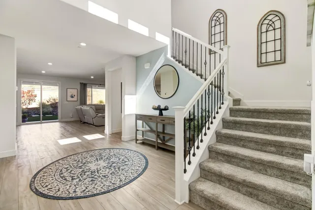 a large kitchen with a table and chairs