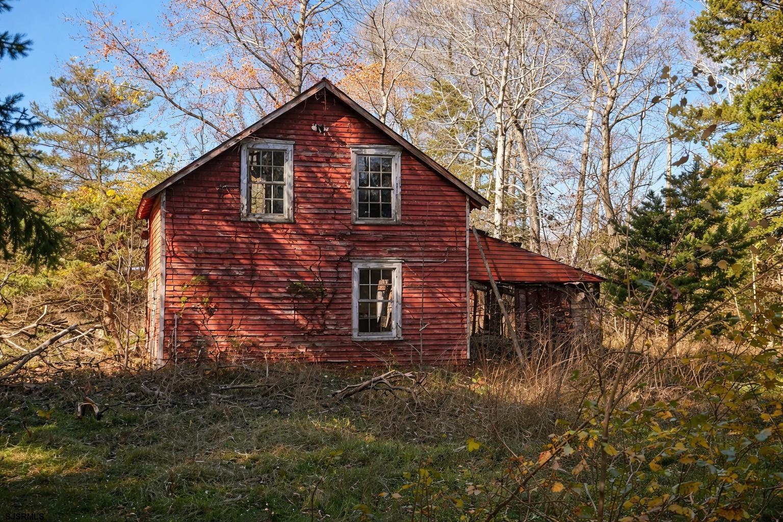 639 Chestnut Neck Road Port Republic, NJ 08241 - Photo 23 of 26 a front view of a house with a yard