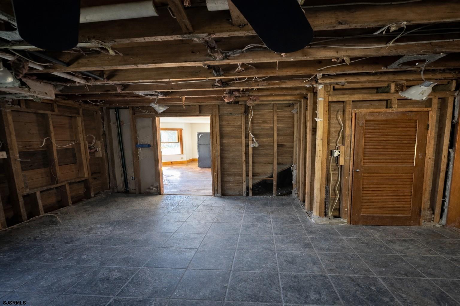 639 Chestnut Neck Road Port Republic, NJ 08241 - Photo 9 of 26 a view of empty room with wooden walls