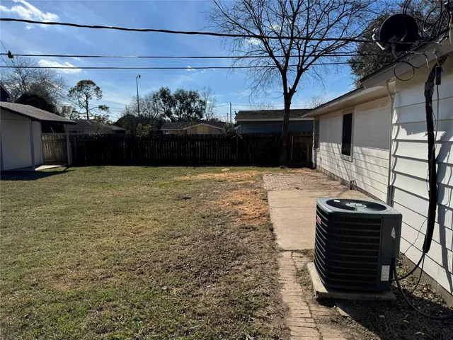 a view of a backyard of the house