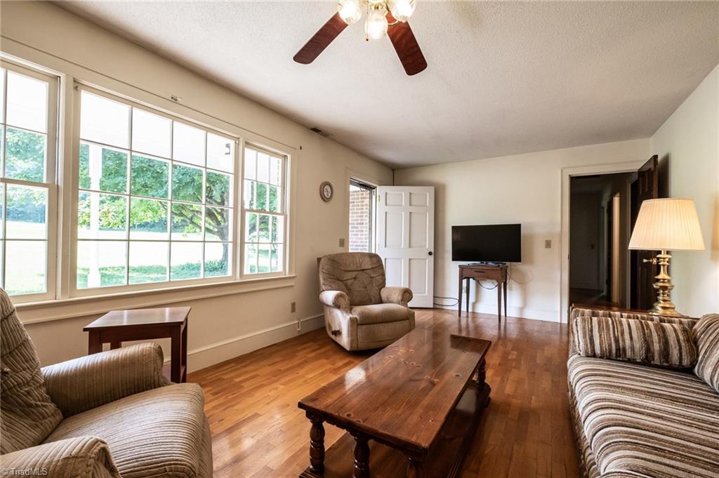 3575 Austin Traphill Road Elkin, NC 28621 - Photo 5 of 30 Spacious living room has large windows that overlook the front yard.