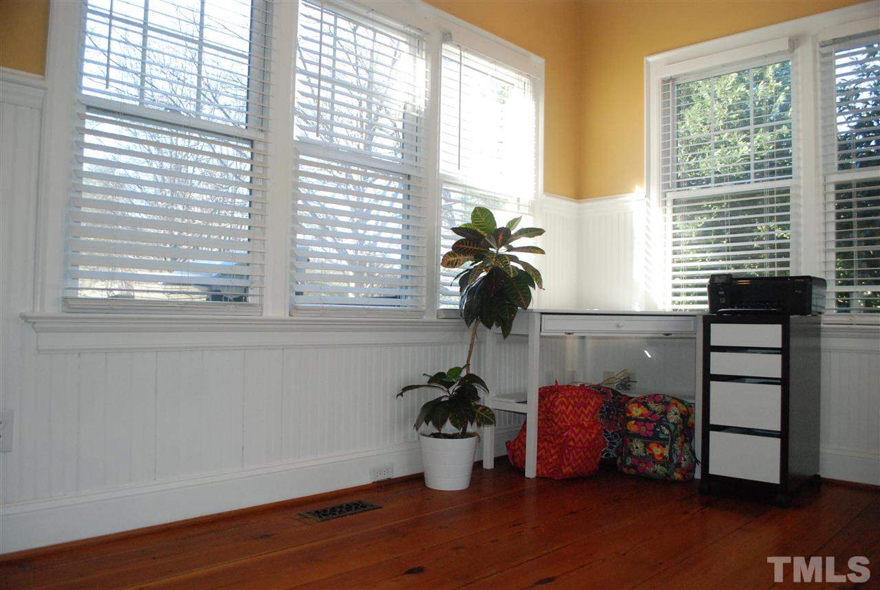 426 Morrison Avenue Raleigh, NC 27608 - Photo 14 of 25 a room with wooden floor and a window