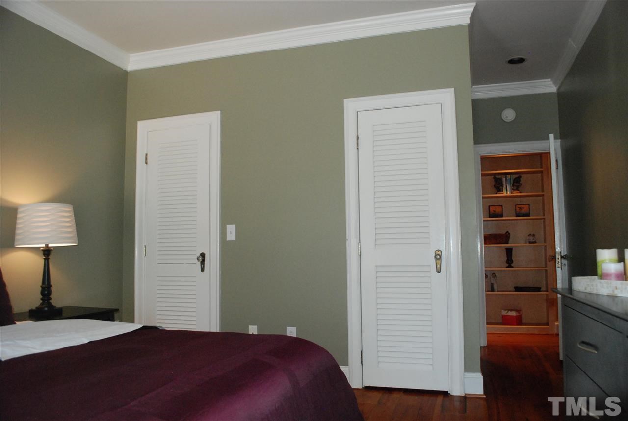 426 Morrison Avenue Raleigh, NC 27608 - Photo 16 of 25 a bedroom with a bed and a night stand