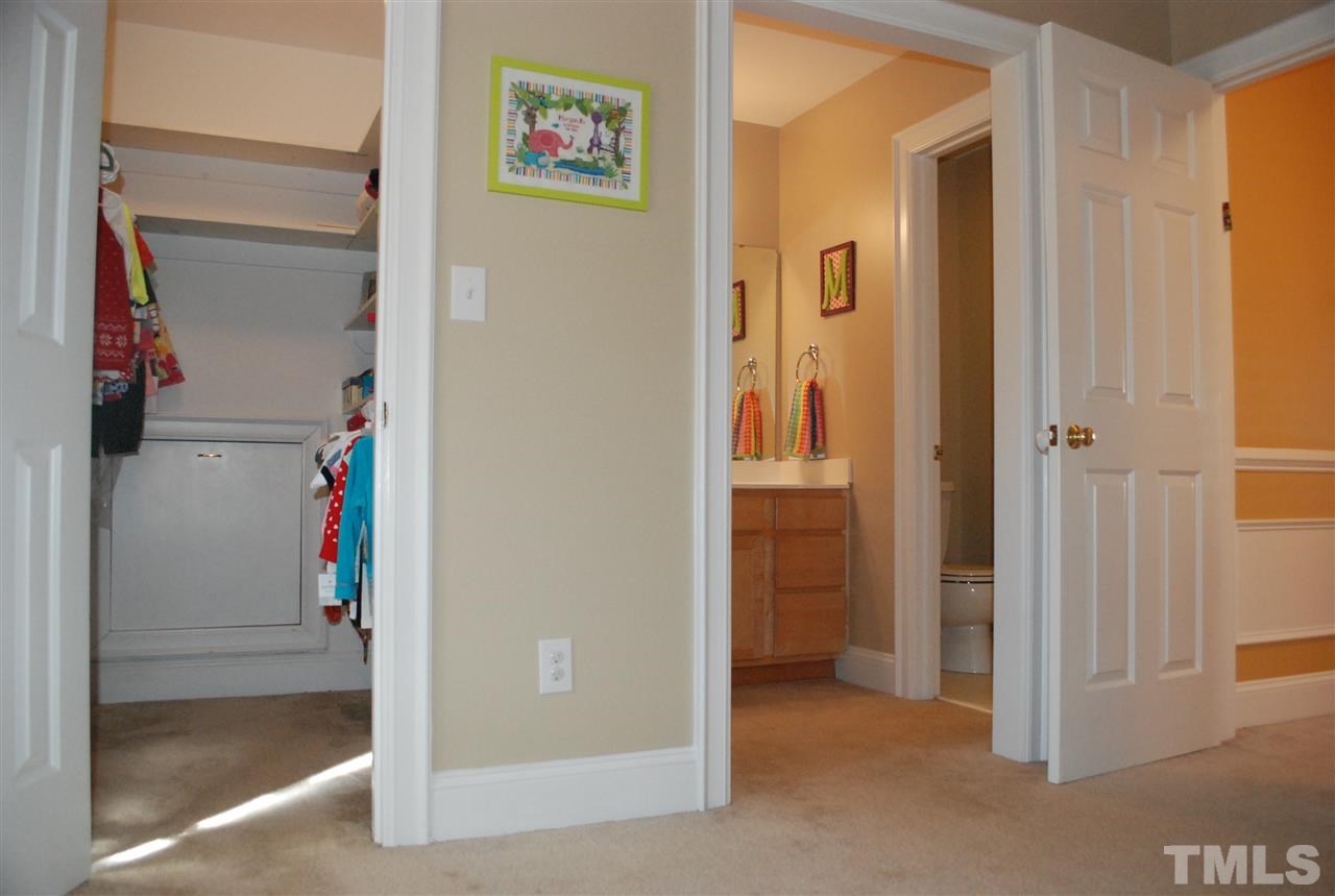 426 Morrison Avenue Raleigh, NC 27608 - Photo 20 of 25 a view of a hallway with wooden shelves
