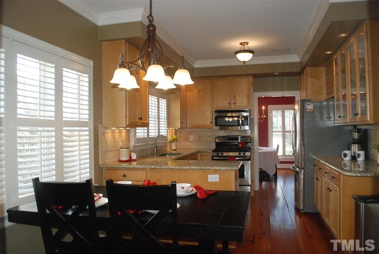426 Morrison Avenue Raleigh, NC 27608 - Photo 5 of 25 a view of a dining room with furniture window and wooden floor