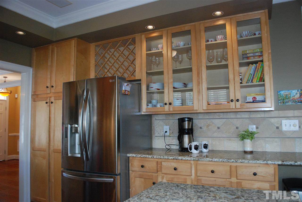 426 Morrison Avenue Raleigh, NC 27608 - Photo 7 of 25 a kitchen with stainless steel appliances granite countertop a refrigerator and a sink