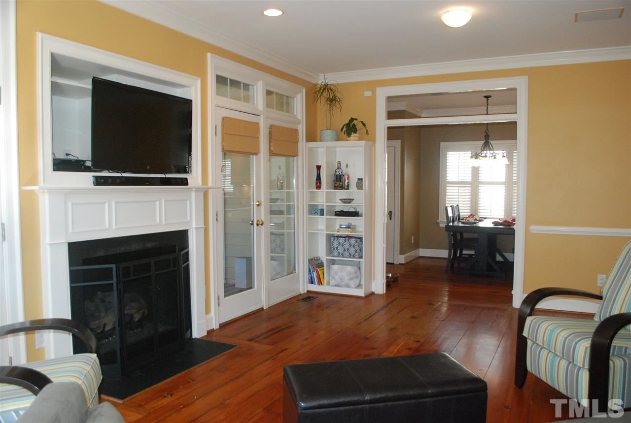 426 Morrison Avenue Raleigh, NC 27608 - Photo 8 of 25 a living room with furniture fireplace and flat screen tv