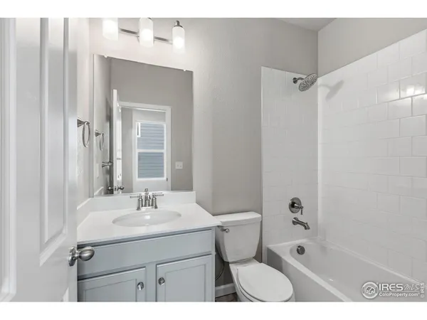 a bathroom with a sink toilet a shower and a mirror