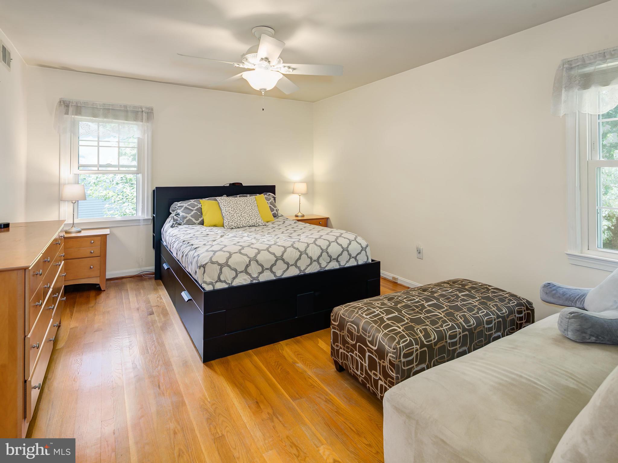 199 Summit Hall Road Gaithersburg, MD 20877 - Photo 11 of 30 a bedroom with two beds and a chair