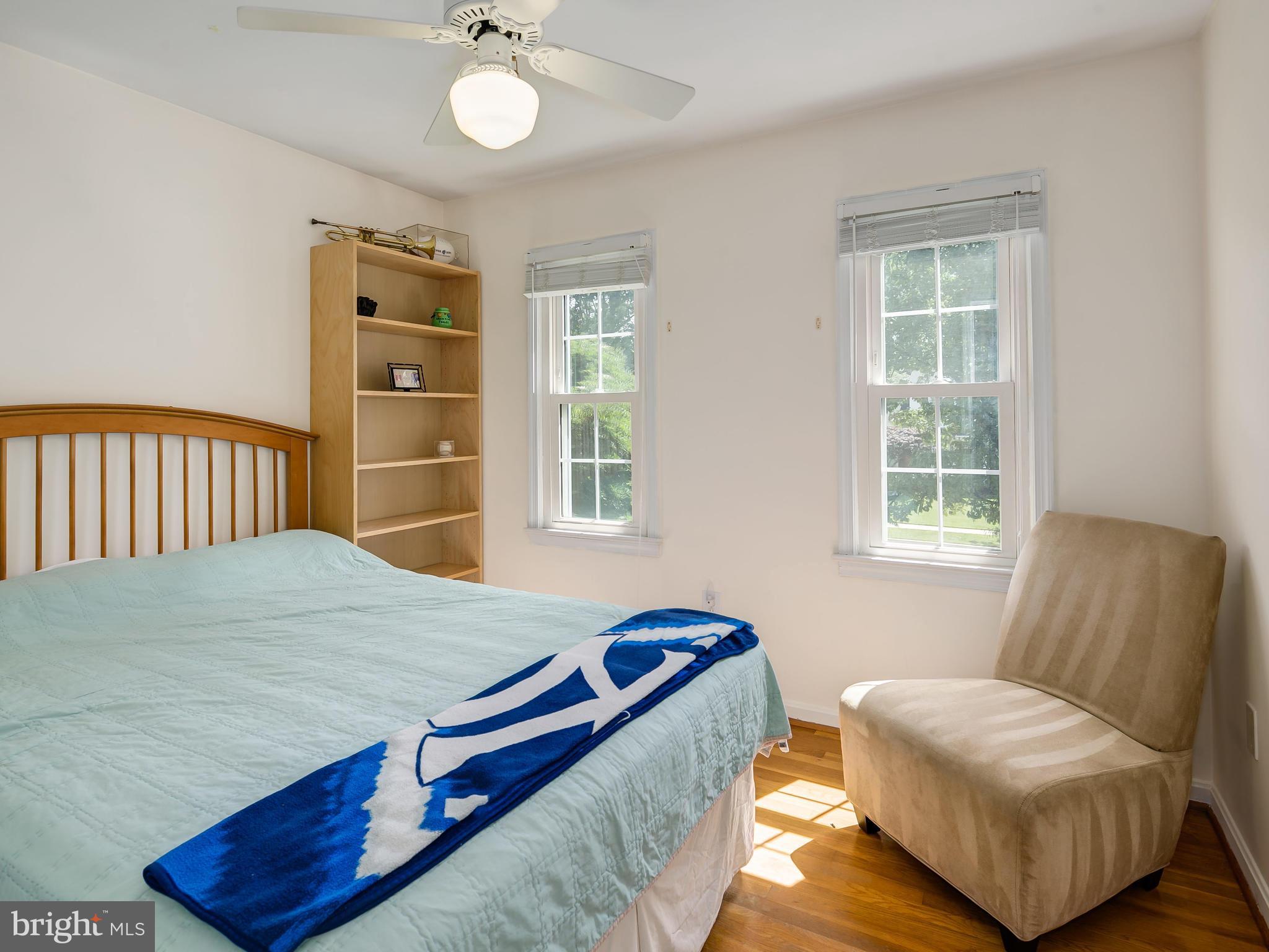 199 Summit Hall Road Gaithersburg, MD 20877 - Photo 17 of 30 a bedroom with a bed and wooden floor