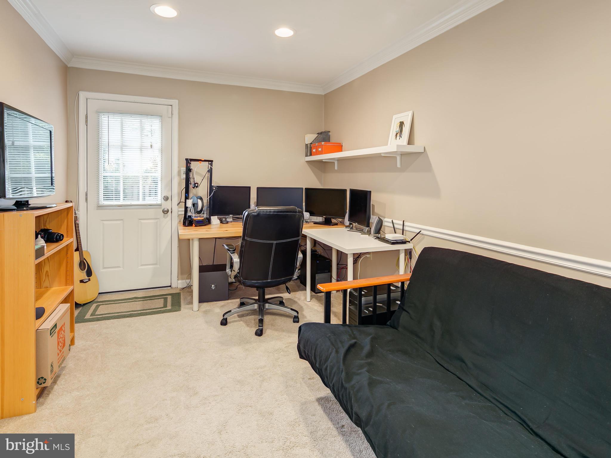 199 Summit Hall Road Gaithersburg, MD 20877 - Photo 21 of 30 a view of a workspace with furniture and a window
