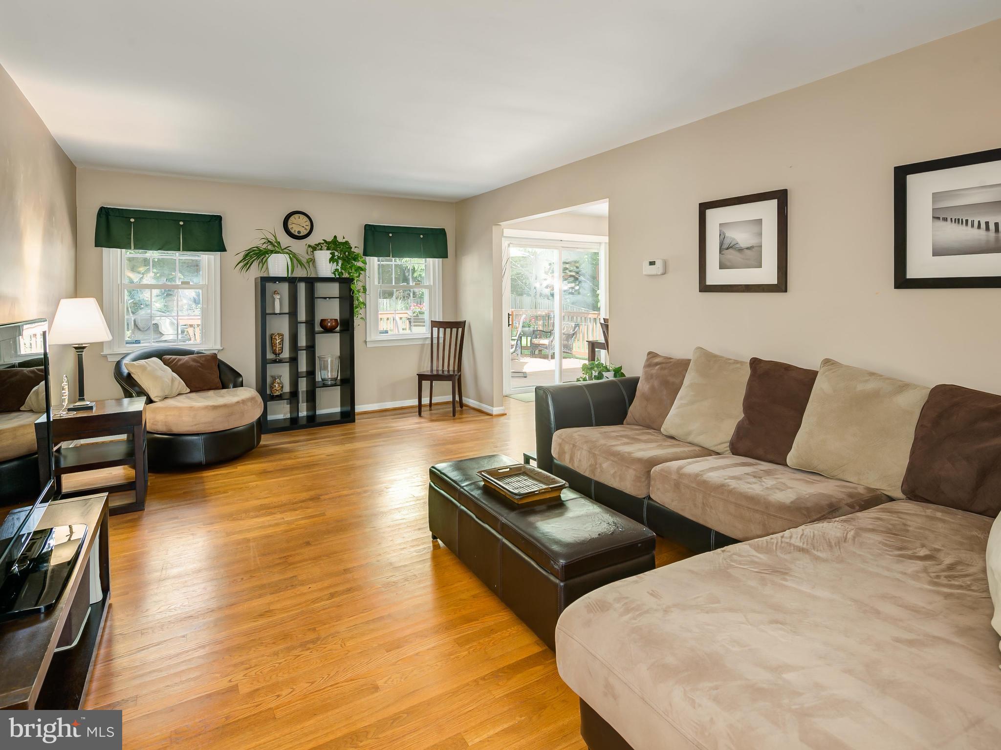 199 Summit Hall Road Gaithersburg, MD 20877 - Photo 4 of 30 a living room with furniture and a wooden floor
