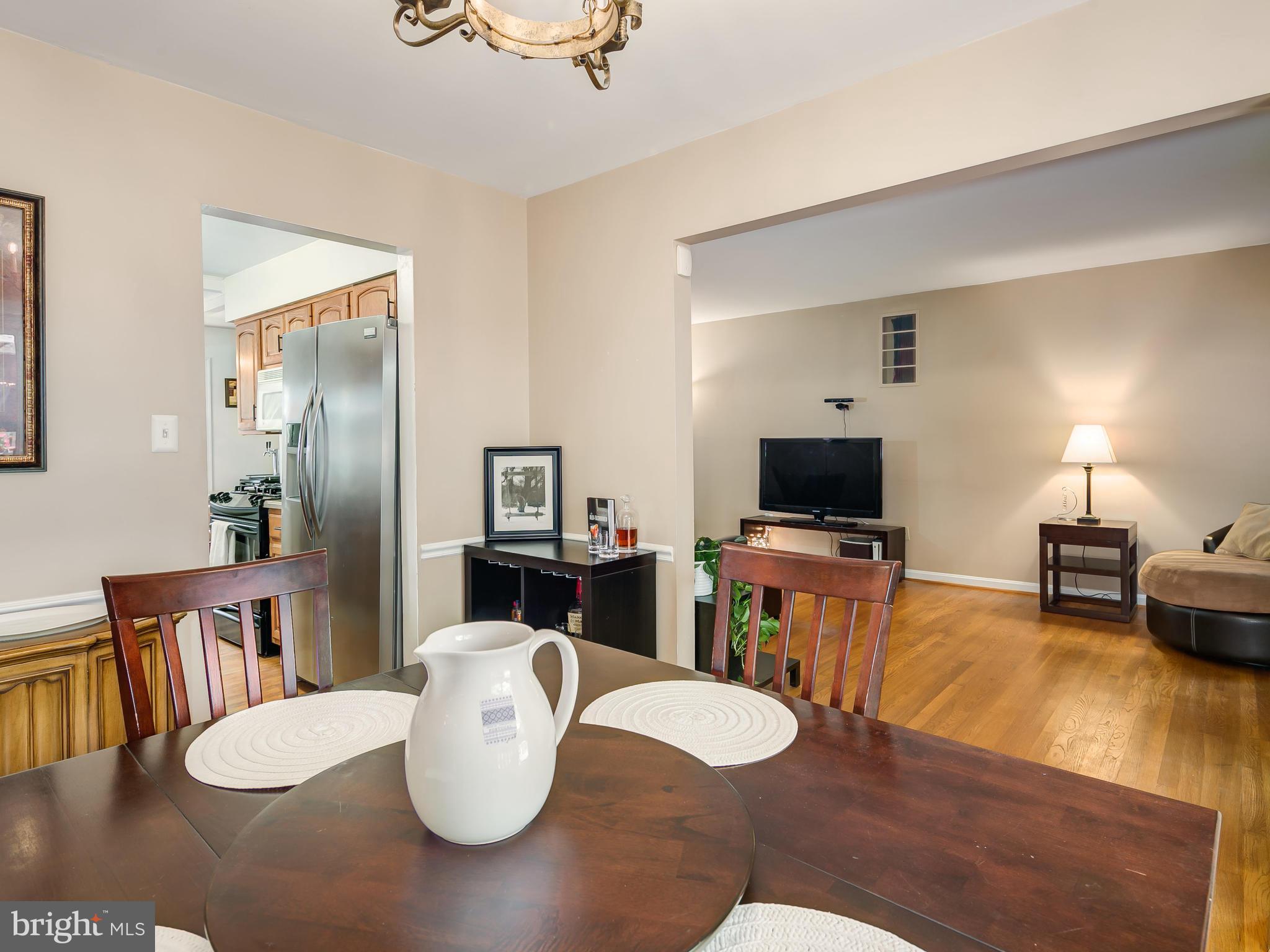 199 Summit Hall Road Gaithersburg, MD 20877 - Photo 7 of 30 a living room with furniture and a flat screen tv