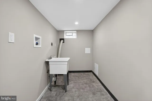 a view of a hallway with seating area