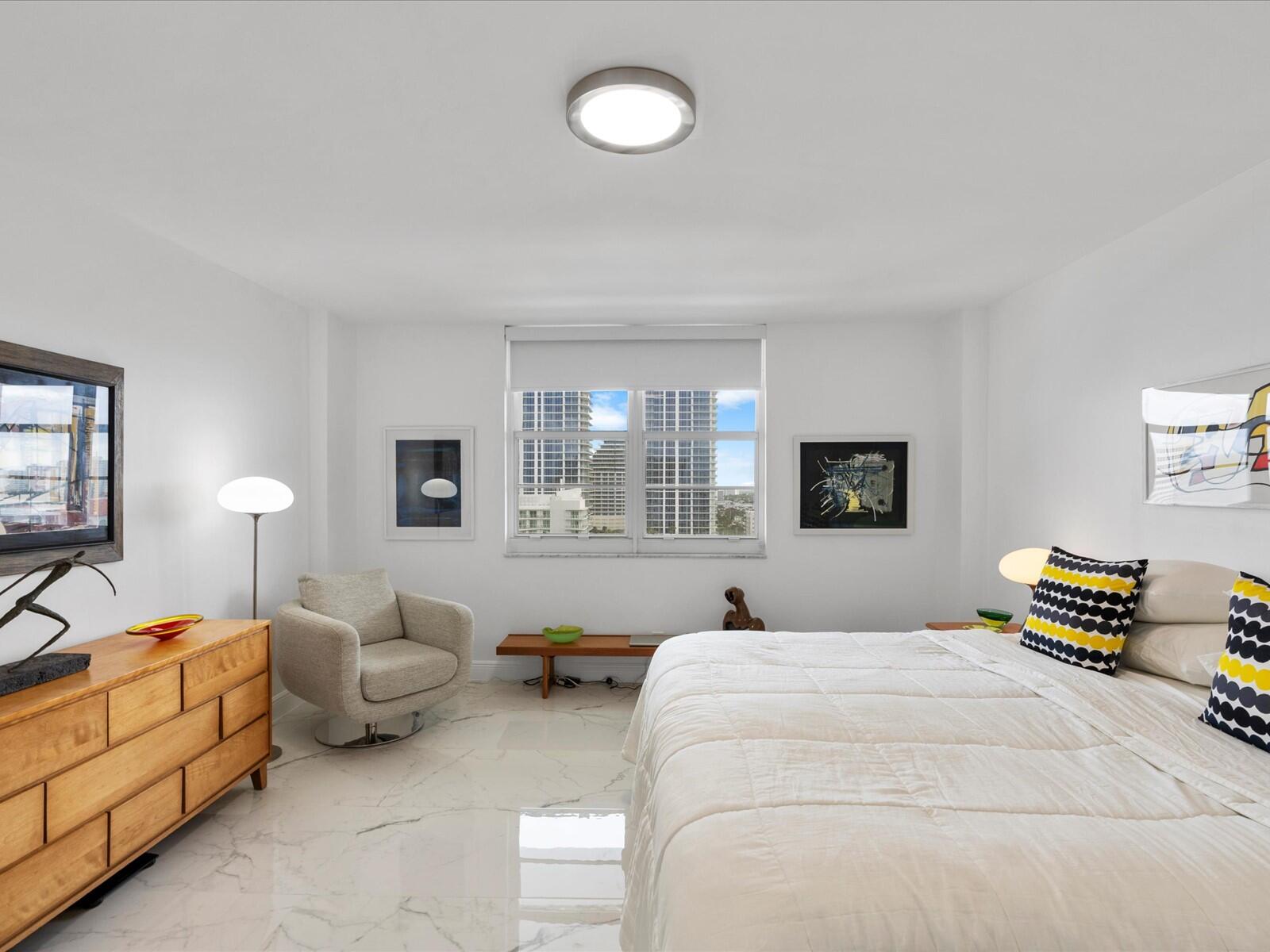 336 North Birch Road, Unit PHI Fort Lauderdale, FL 33304 - Photo 23 of 63 a bedroom with bed and window