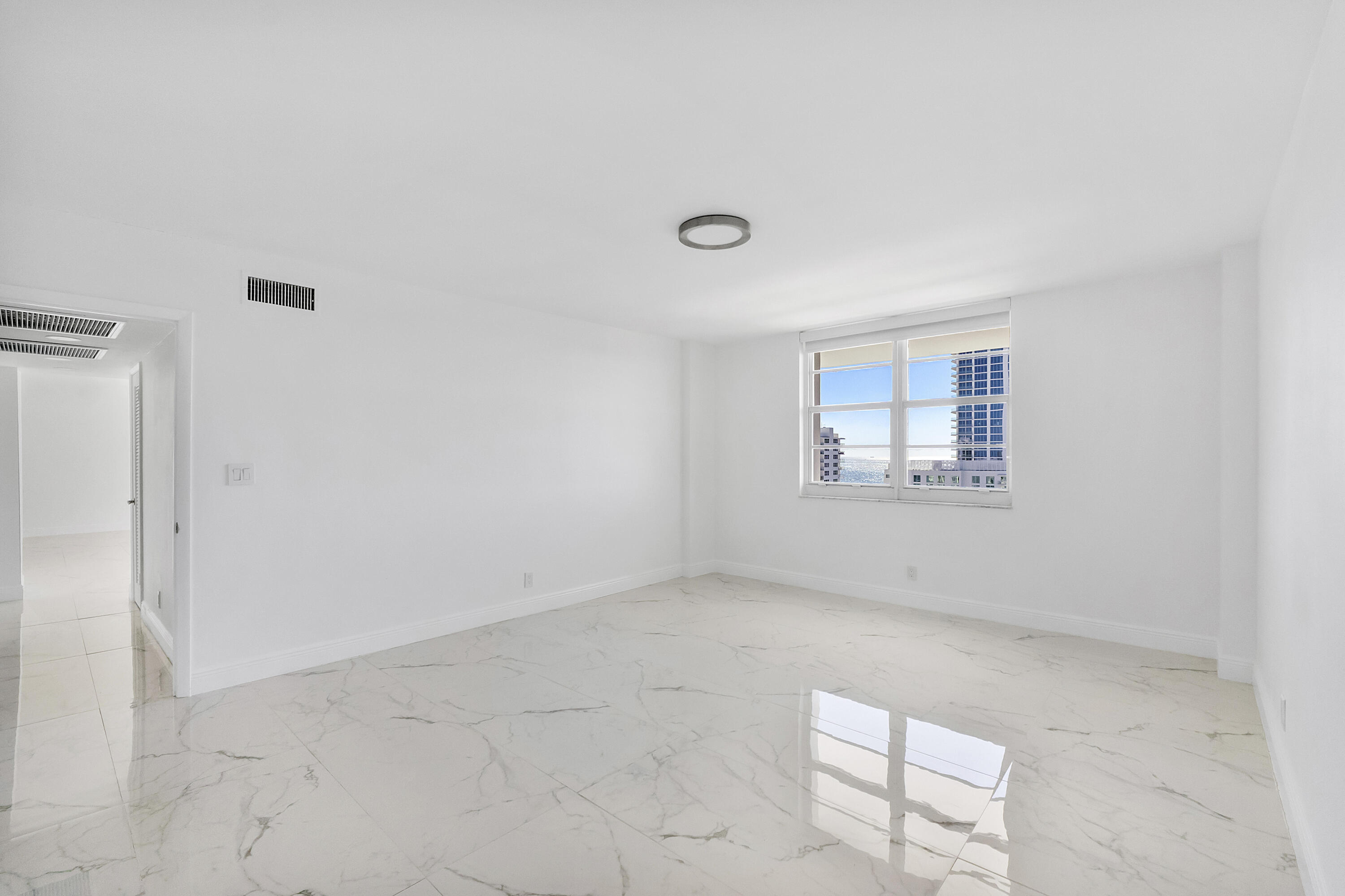 336 North Birch Road, Unit PHI Fort Lauderdale, FL 33304 - Photo 26 of 63 an empty room with windows