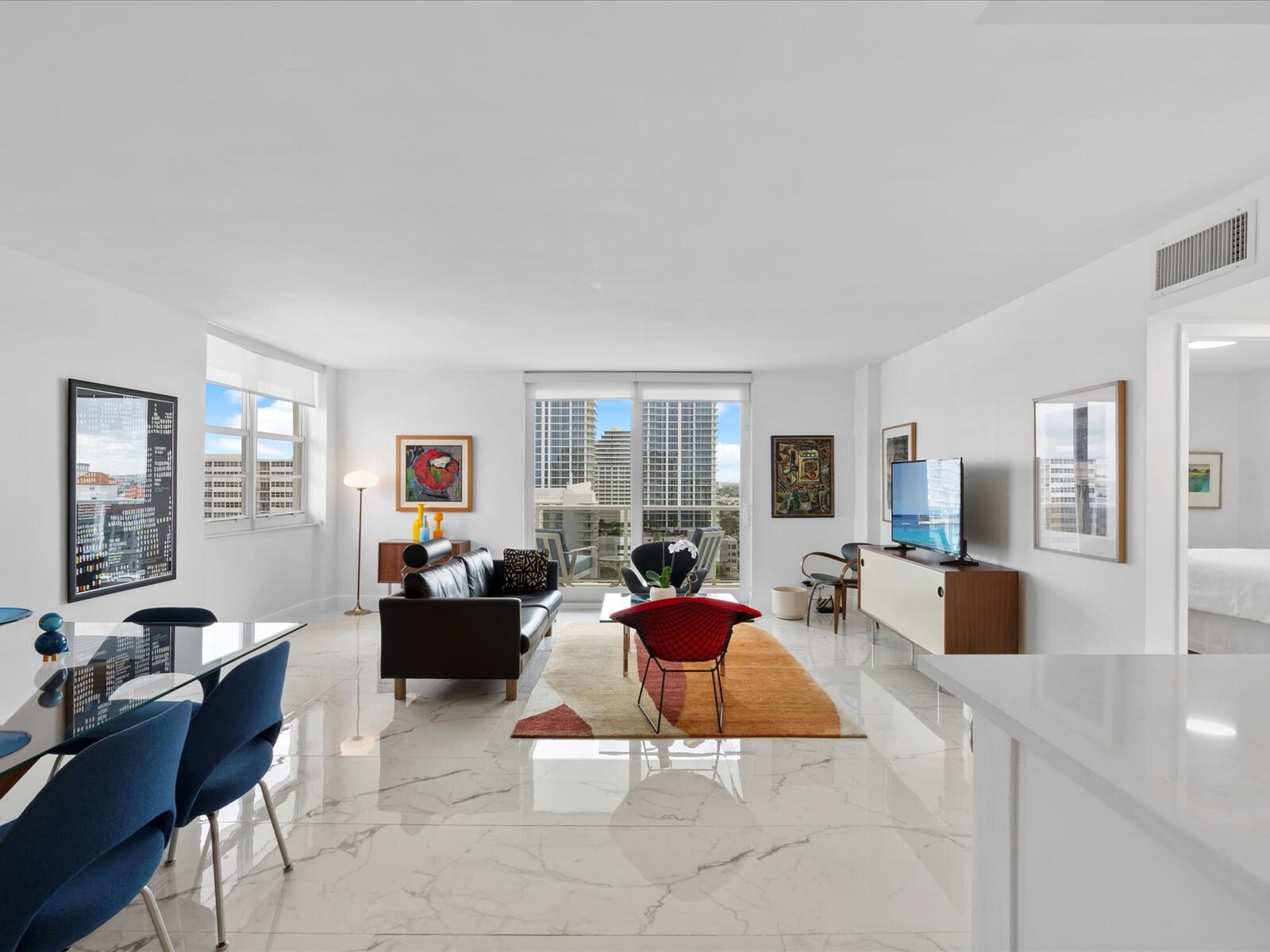 336 North Birch Road, Unit PHI Fort Lauderdale, FL 33304 - Photo 3 of 63 a living room with furniture large window and couch