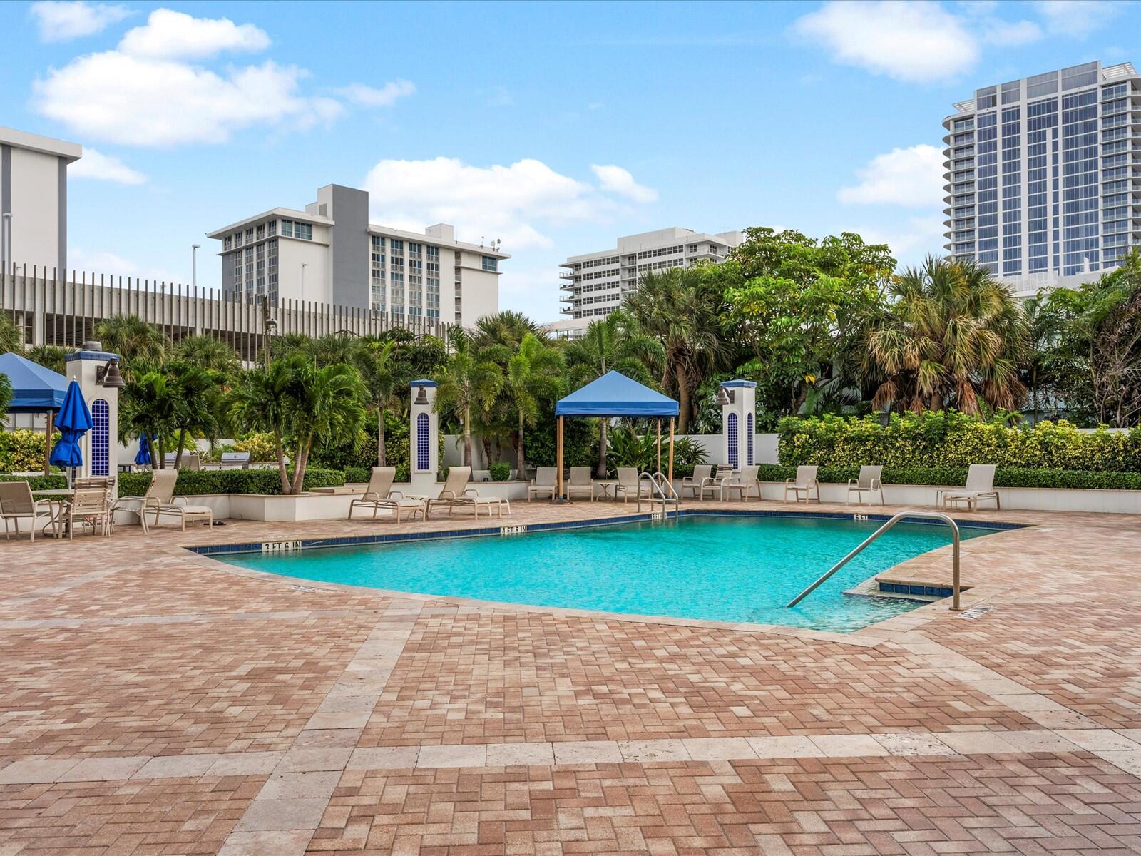 336 North Birch Road, Unit PHI Fort Lauderdale, FL 33304 - Photo 37 of 63 a view of a swimming pool with a patio