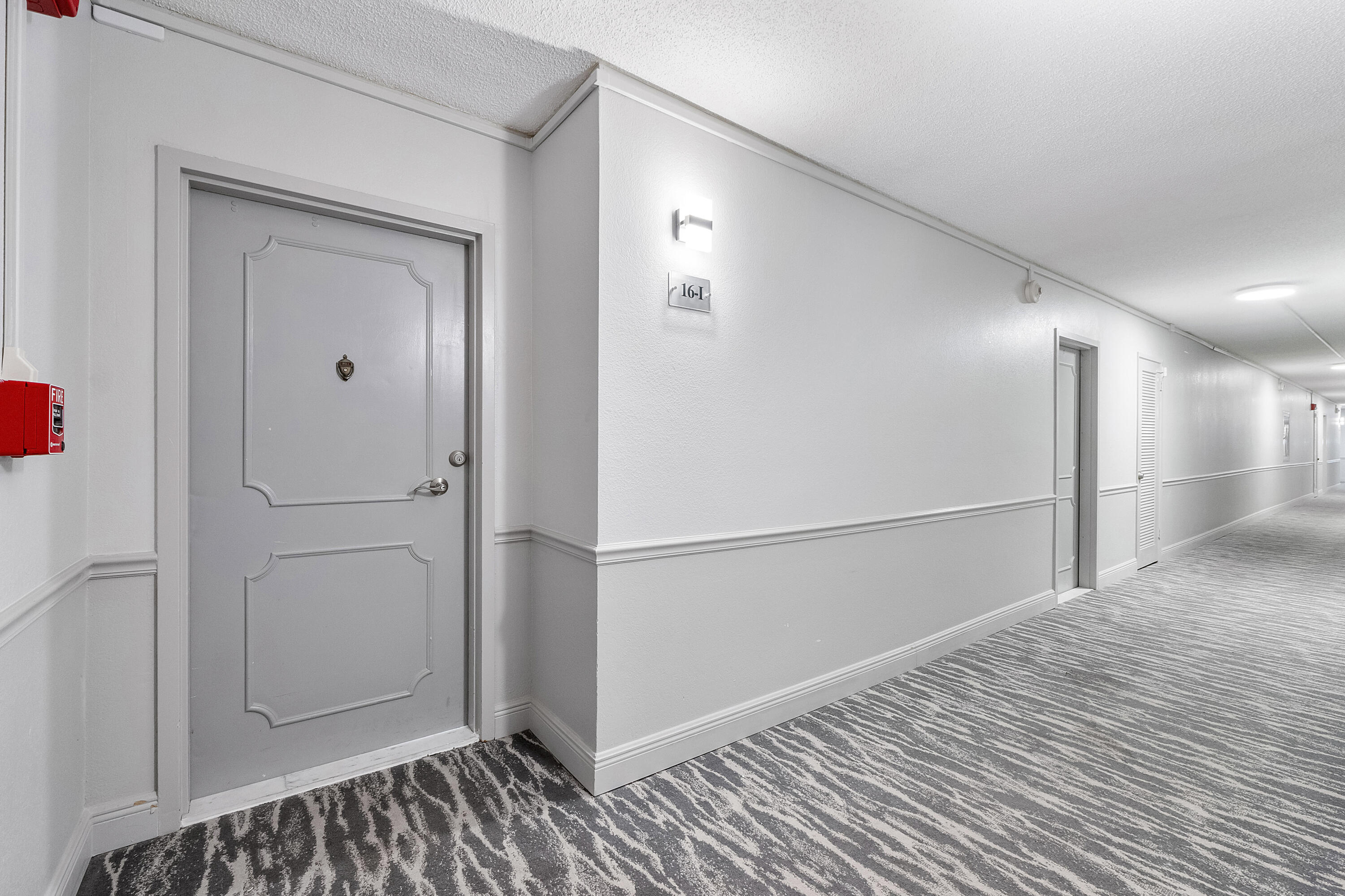 336 North Birch Road, Unit PHI Fort Lauderdale, FL 33304 - Photo 54 of 63 a view of a hallway with wooden floor and closet area