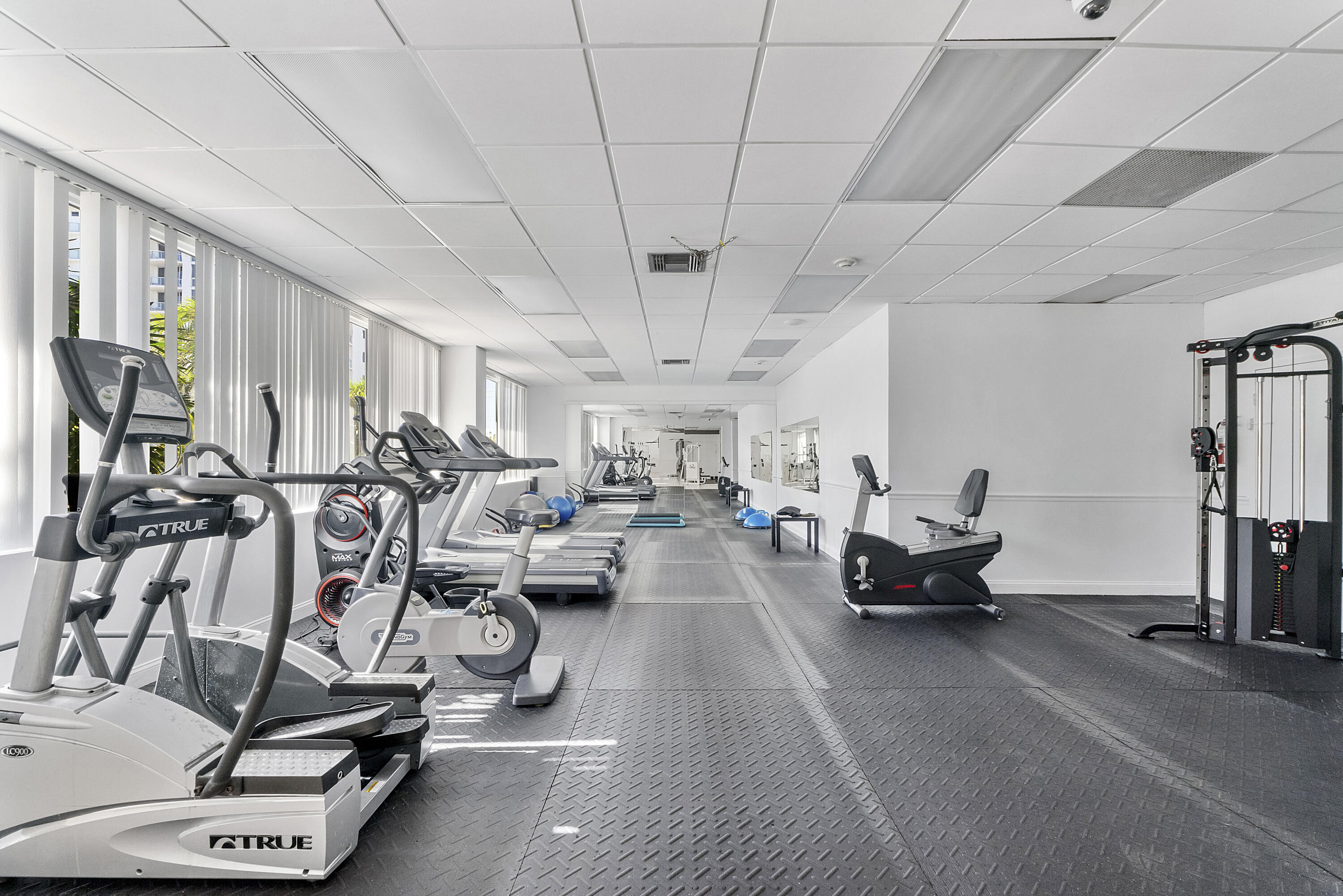 336 North Birch Road, Unit PHI Fort Lauderdale, FL 33304 - Photo 59 of 63 a living room with lots of gym equipment and a view of living room