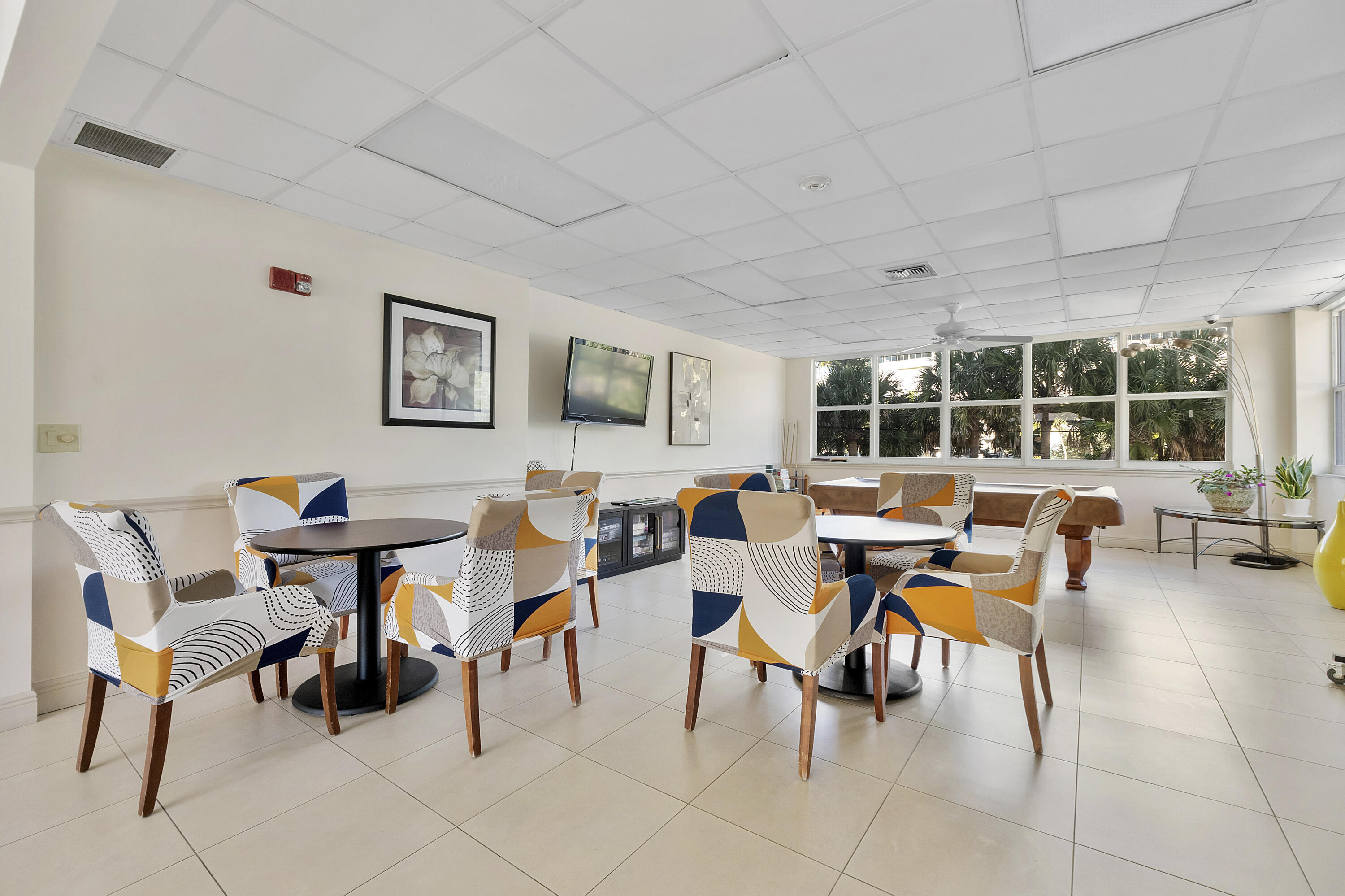 336 North Birch Road, Unit PHI Fort Lauderdale, FL 33304 - Photo 61 of 63 a view of a dining room with furniture and a potted plant