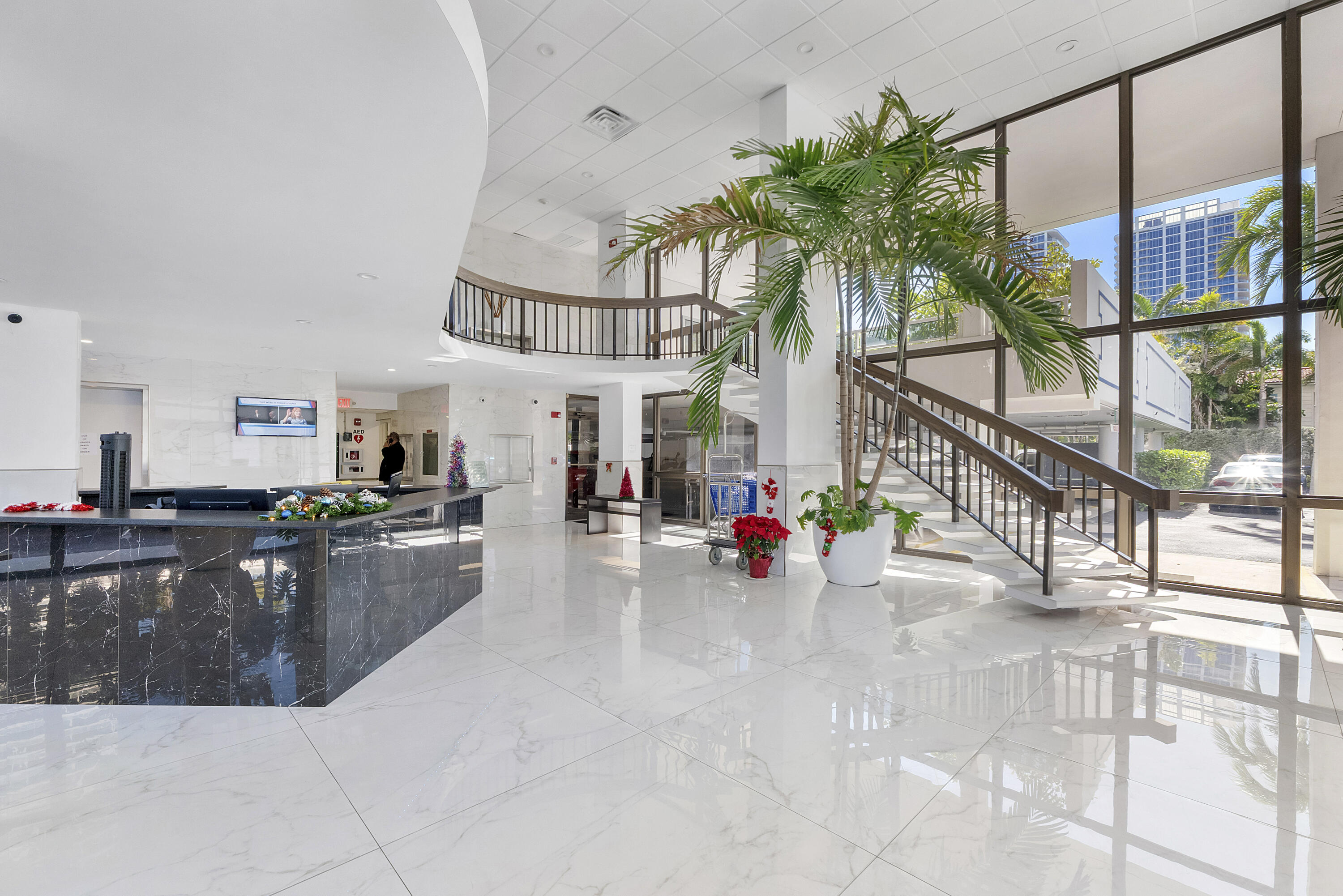 336 North Birch Road, Unit PHI Fort Lauderdale, FL 33304 - Photo 62 of 63 a living room with furniture and potted plants