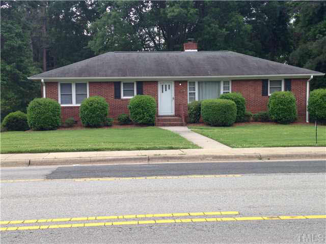 606 Ridge Road Roxboro, NC 27573 - Photo 1 of 6 a front view of a house with a yard and garage