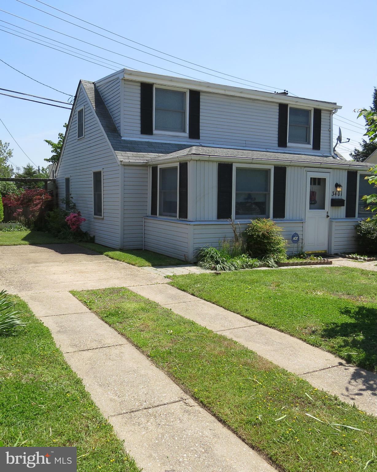 3401 Sollers Point Road Baltimore, MD 21222 - Photo 1 of 29 a front view of a house with a yard and a porch