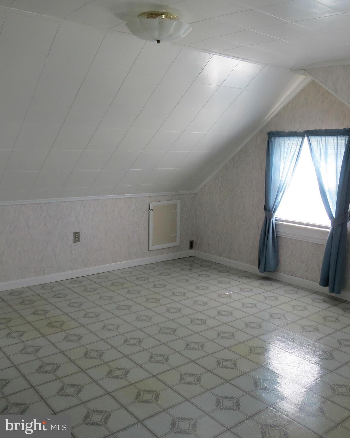3401 Sollers Point Road Baltimore, MD 21222 - Photo 16 of 29 an empty room with a empty space and windows