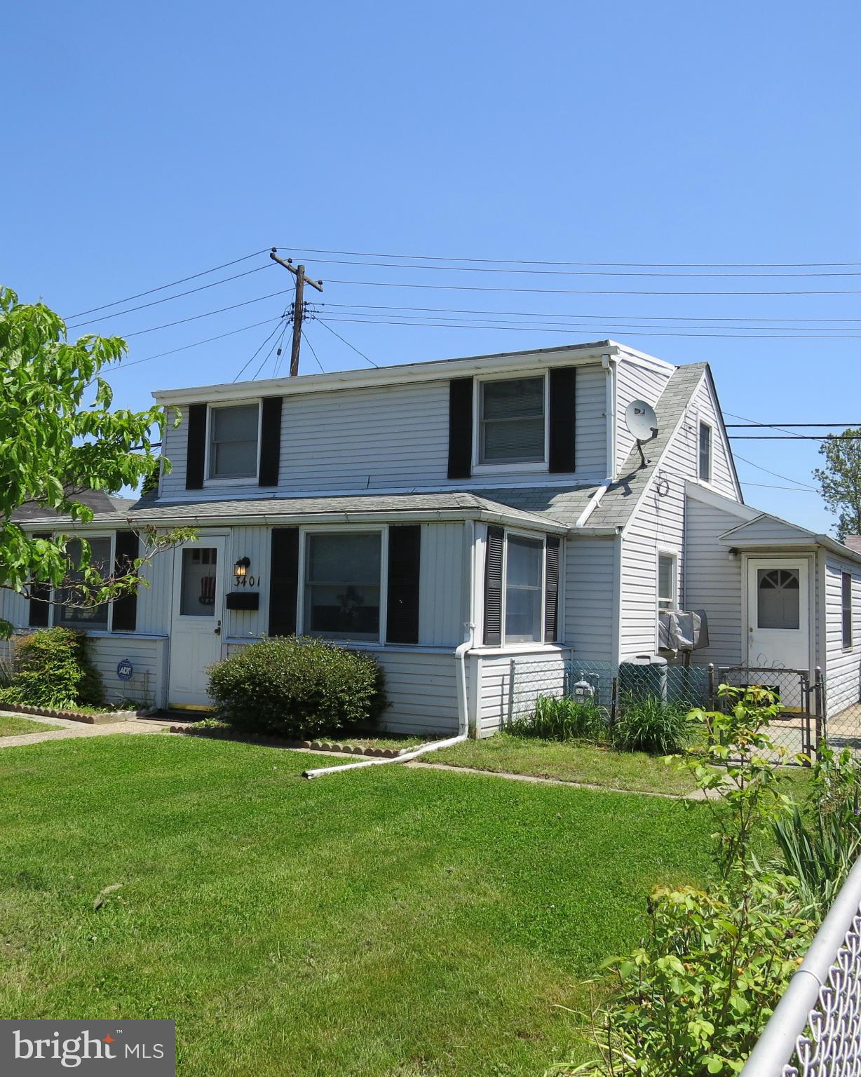 3401 Sollers Point Road Baltimore, MD 21222 - Photo 25 of 29 a front view of a house with a yard and trees