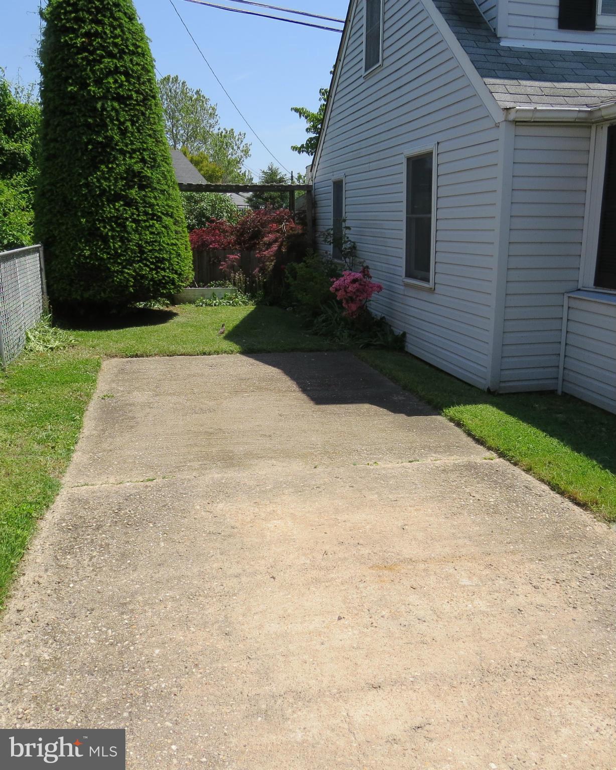 3401 Sollers Point Road Baltimore, MD 21222 - Photo 29 of 29 a view of a backyard with plants and trees
