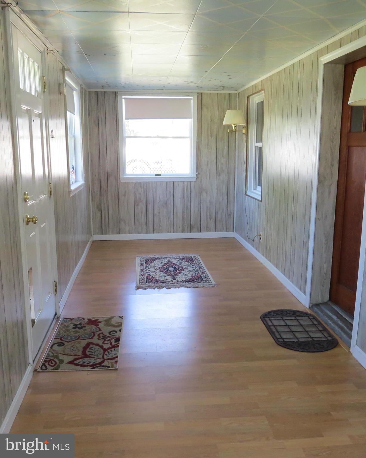 3401 Sollers Point Road Baltimore, MD 21222 - Photo 5 of 29 a view of wooden floor and windows in a room