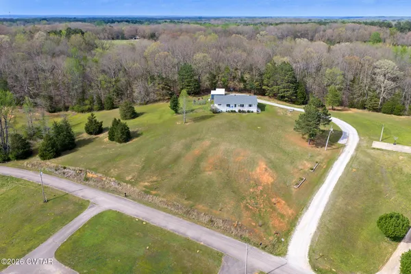 a view of a swimming pool with a yard
