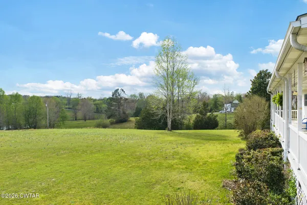 a view of a field with an ocean