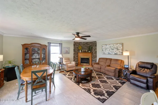 a living room with furniture and a fireplace