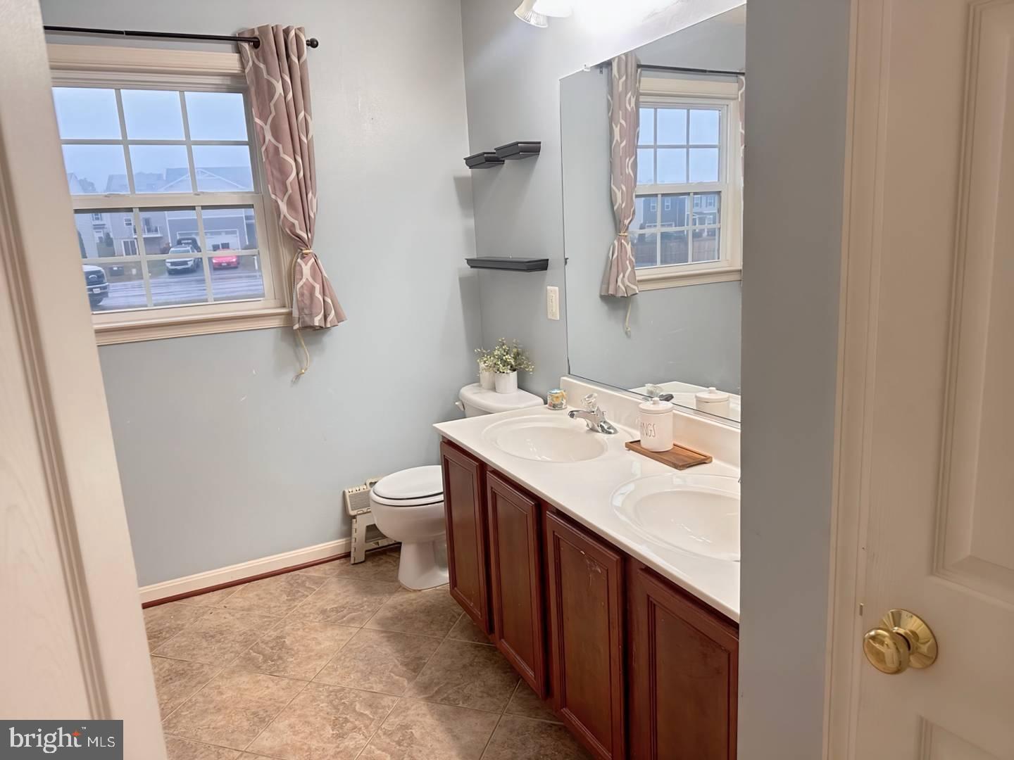 35391 Pheasant Ridge Road Locust Grove, VA 22508 - Photo 12 of 16 a bathroom with a sink a toilet and shower