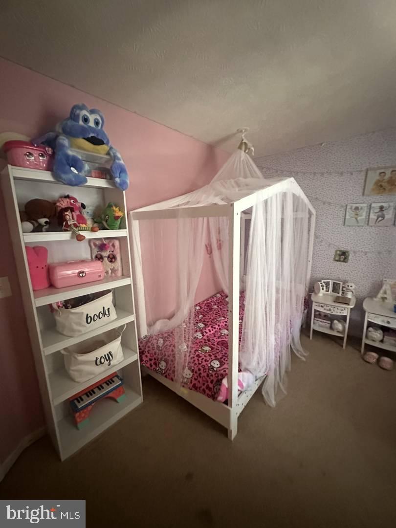 35391 Pheasant Ridge Road Locust Grove, VA 22508 - Photo 13 of 16 a bedroom with furniture and a baby crib