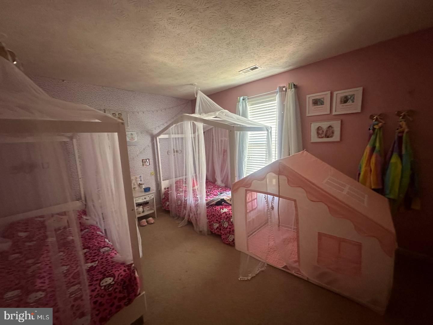 35391 Pheasant Ridge Road Locust Grove, VA 22508 - Photo 14 of 16 a bedroom with a bed next to a window